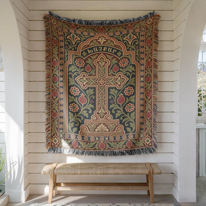 Khachkar cross tapestry in a pointed arch hung on white shiplap above a wooden bench