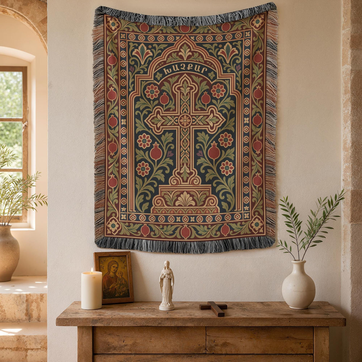 Khachkar cross tapestry in a pointed arch on a plaster wall beside an arched window and potted plants
