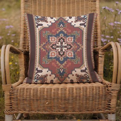 Rust blue woven pillow cover with beige geometric rug-inspired pattern