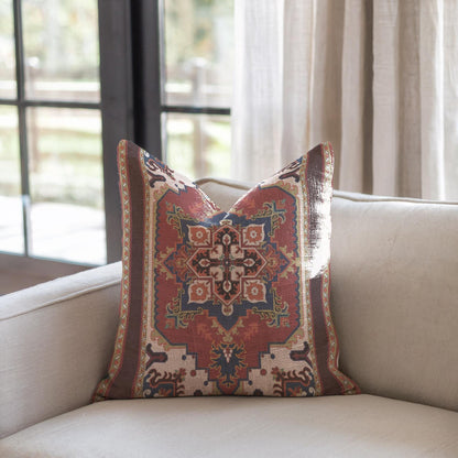 Rust blue woven pillow cover with beige geometric rug-inspired pattern