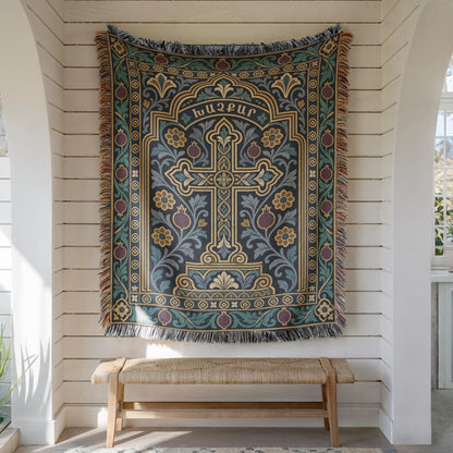 Teal khachkar cross tapestry in a pointed arch hung on white shiplap above a wooden bench