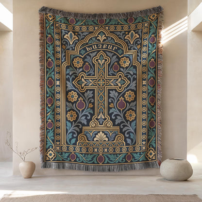 Teal khachkar cross tapestry in a pointed arch on a plaster wall between two round stoneware vases
