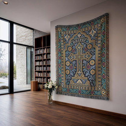 Teal khachkar cross tapestry in a pointed arch in a corner room with floor-to-ceiling windows and bookshelves