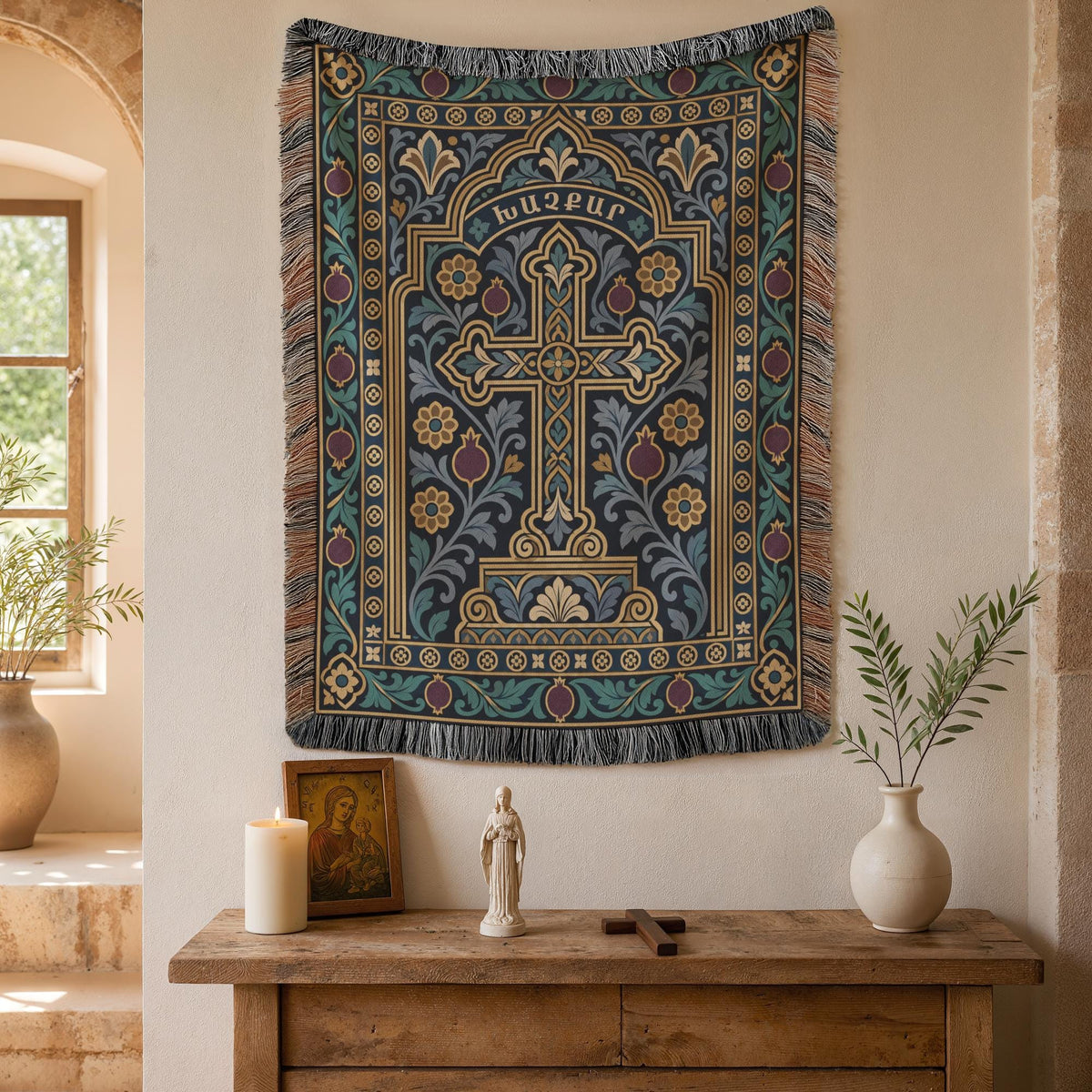 Teal khachkar cross tapestry in a pointed arch on a plaster wall beside an arched window and potted plants