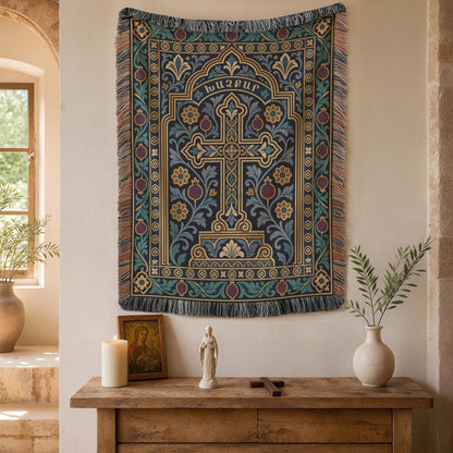 Teal khachkar cross tapestry in a pointed arch on a plaster wall beside an arched window and potted plants
