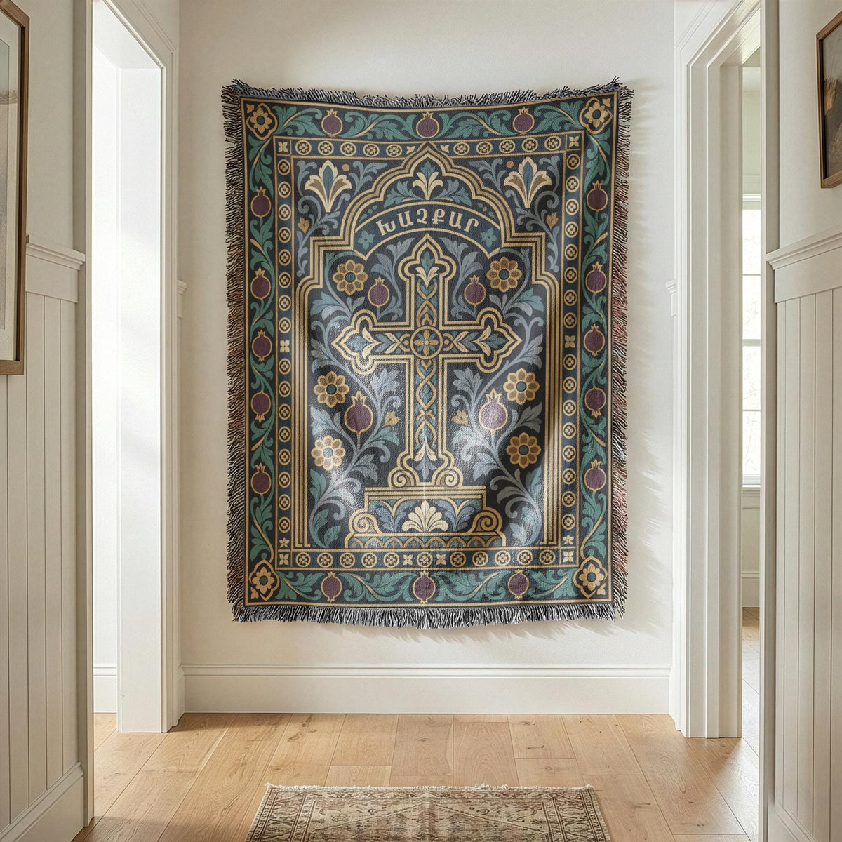Teal khachkar cross tapestry in a pointed arch at the end of a white hallway, fringed edges visible